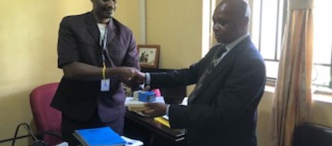 CAO Gidongo Peter handing over office to DCAO Mr. Mutungi Robert.
